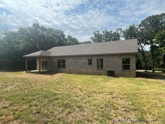 11130 Spanish Oak, Kingston, OK 73439 - back of house with a lawn and brick siding