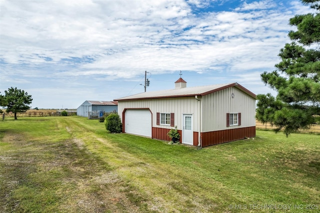 4556 E 330th Rd, Talala, OK 74080 - rear view of property with an outbuilding, a yard, a garage, and board and batten siding