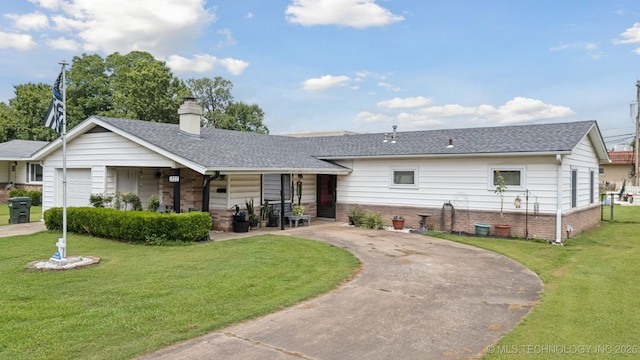 1222 N Cherrington Ave, Claremore, OK 74017 - view of front of property featuring brick siding, covered porch, curved driveway, a front lawn, and a shingled roof