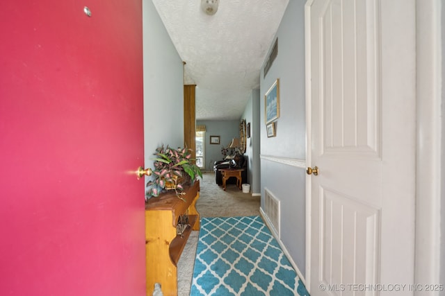 1222 N Cherrington Ave, Claremore, OK 74017 - hallway with carpet and a textured ceiling