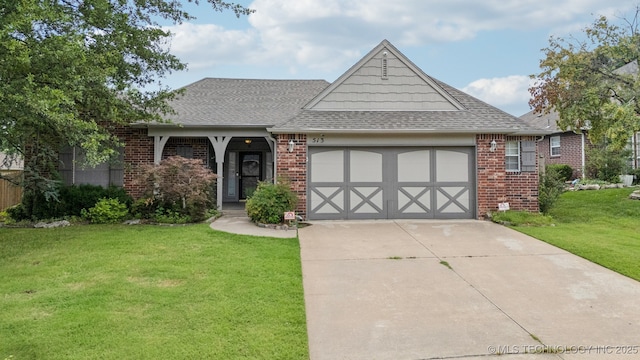 513 S 63rd Pl S, Broken Arrow, OK 74014 - view of front of house with a front yard, a garage, driveway, and brick siding