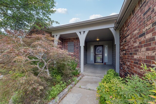 513 S 63rd Pl S, Broken Arrow, OK 74014 - entrance to property with brick siding and a porch
