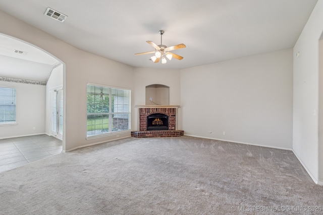 513 S 63rd Pl S, Broken Arrow, OK 74014 - unfurnished living room featuring carpet flooring, a ceiling fan, and a fireplace