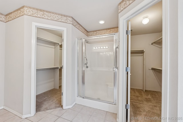 513 S 63rd Pl S, Broken Arrow, OK 74014 - bathroom with a walk in closet, a shower stall, tile patterned flooring, and recessed lighting