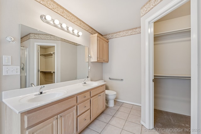 513 S 63rd Pl S, Broken Arrow, OK 74014 - full bath featuring a spacious closet, double vanity, a shower stall, and tile patterned flooring
