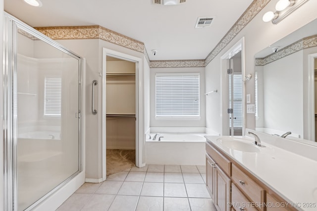 513 S 63rd Pl S, Broken Arrow, OK 74014 - bathroom with a shower stall, a garden tub, a walk in closet, and double vanity