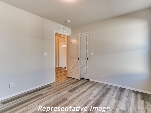7218 E 132nd St S, Bixby, OK 74008 - spare room with light wood-style floors and a smoke detector
