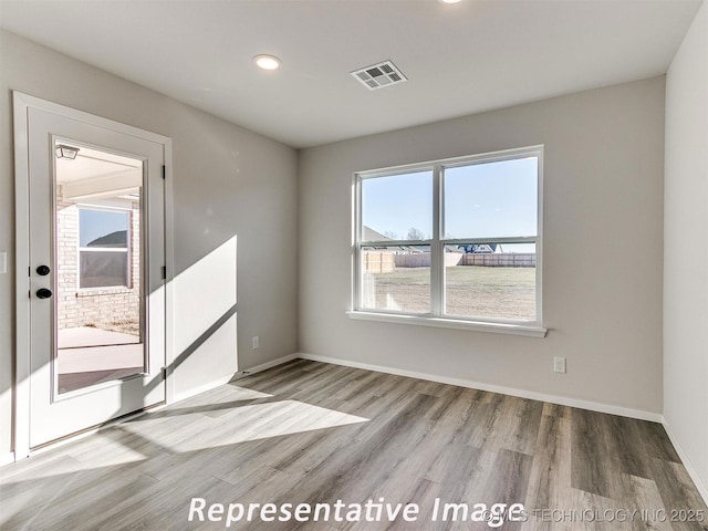 7218 E 132nd St S, Bixby, OK 74008 - spare room with wood finished floors and recessed lighting
