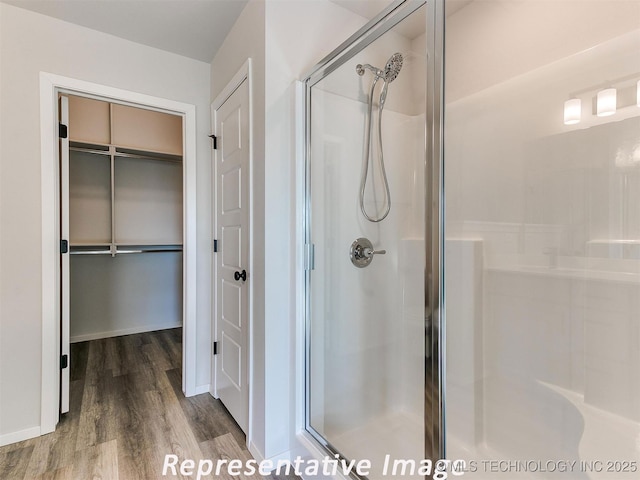 7218 E 132nd St S, Bixby, OK 74008 - full bath with a shower stall, wood finished floors, and a walk in closet