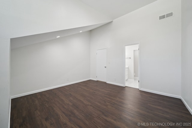 6002 S Atlanta Ct Unit 2, Tulsa, OK 74105 - spare room with high vaulted ceiling, dark wood-style flooring, and recessed lighting