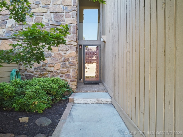 6002 S Atlanta Ct Unit 2, Tulsa, OK 74105 - property entrance with stone siding