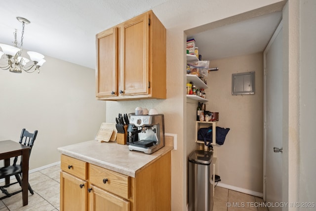 6152 S Madison Pl Unit B, Tulsa, OK 74136 - kitchen with light tile patterned floors, a chandelier, light countertops, hanging light fixtures, and light brown cabinets