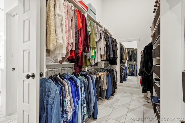 2035 E 138th Pl S, Bixby, OK 74008 - walk in closet featuring marble look tile flooring