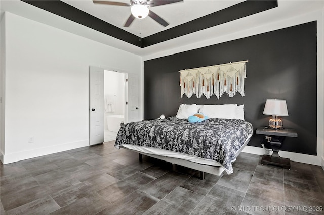2035 E 138th Pl S, Bixby, OK 74008 - bedroom featuring a raised ceiling, wood finished floors, and a ceiling fan