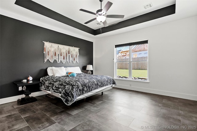2035 E 138th Pl S, Bixby, OK 74008 - bedroom featuring a raised ceiling, a ceiling fan, and tile patterned floors