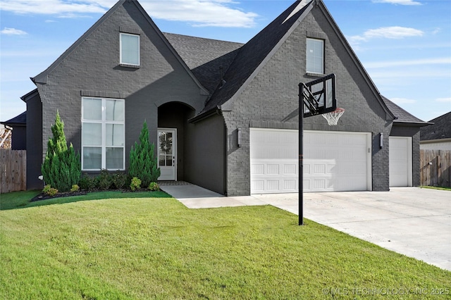 2035 E 138th Pl S, Bixby, OK 74008 - french country inspired facade featuring brick siding, concrete driveway, roof with shingles, and an attached garage