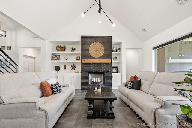 2035 E 138th Pl S, Bixby, OK 74008 - living room with built in features, high vaulted ceiling, and a fireplace