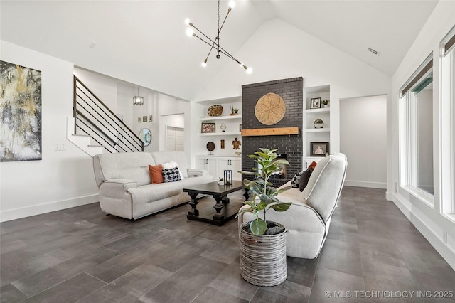 2035 E 138th Pl S, Bixby, OK 74008 - living room with built in shelves, high vaulted ceiling, stairway, a chandelier, and a brick fireplace