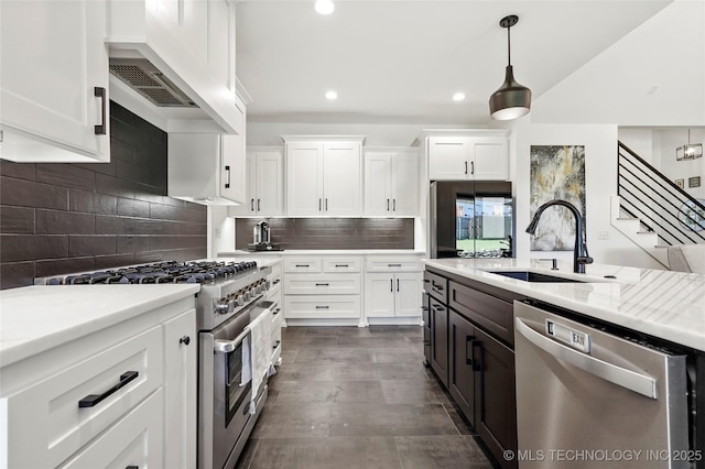 2035 E 138th Pl S, Bixby, OK 74008 - kitchen with stainless steel appliances, white cabinets, recessed lighting, custom range hood, and pendant lighting
