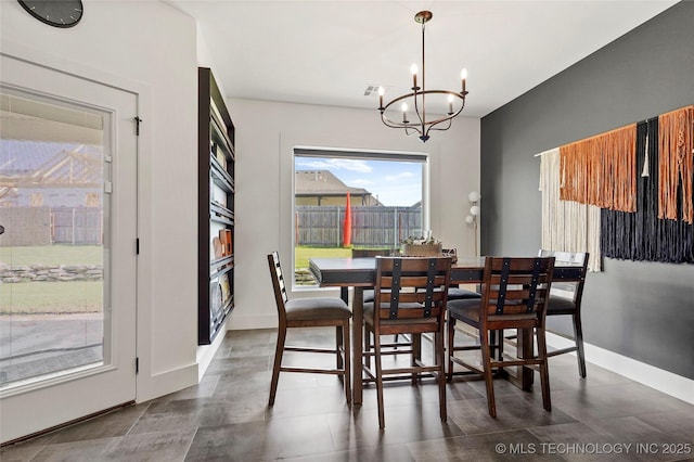 2035 E 138th Pl S, Bixby, OK 74008 - dining space featuring a chandelier and baseboards