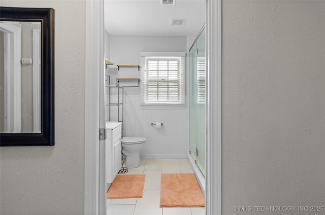 925 W Cedar St N, Durant, OK 74701 - full bathroom featuring vanity, a stall shower, and tile patterned flooring