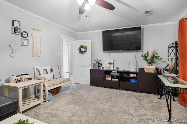 925 W Cedar St N, Durant, OK 74701 - carpeted living area with crown molding and ceiling fan