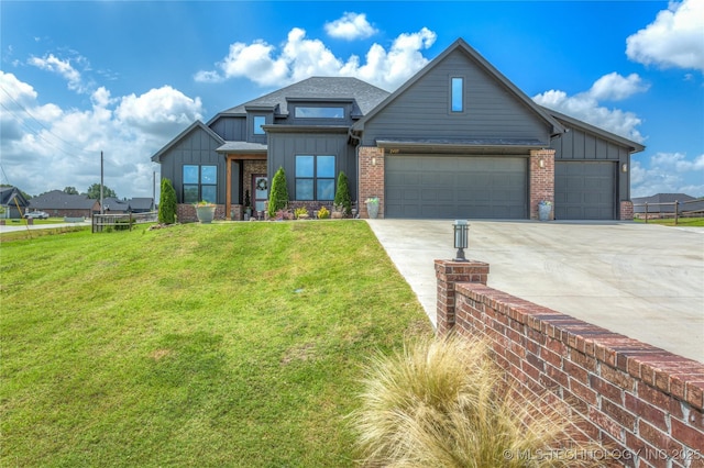 2407 W Union Pl, Collinsville, OK 74021 - view of front of home with board and batten siding, concrete driveway, a front yard, and a garage