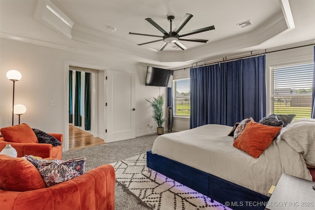 2407 W Union Pl, Collinsville, OK 74021 - bedroom with a raised ceiling, carpet floors, crown molding, and ceiling fan