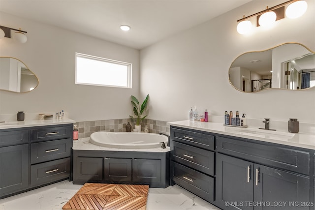2407 W Union Pl, Collinsville, OK 74021 - bathroom featuring marble finish flooring, two vanities, and a bath