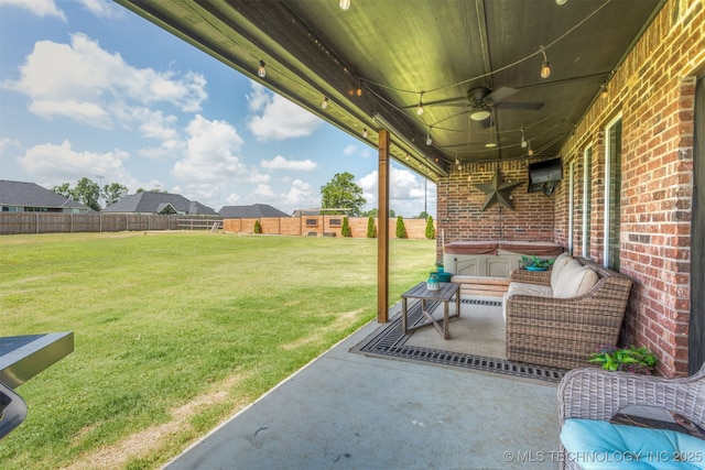 2407 W Union Pl, Collinsville, OK 74021 - fenced backyard featuring a ceiling fan, a patio area, and a hot tub