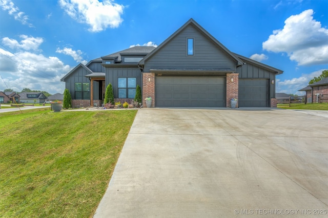 2407 W Union Pl, Collinsville, OK 74021 - view of front of house with board and batten siding, driveway, a garage, and brick siding