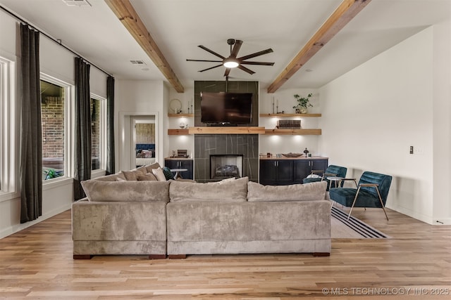 2407 W Union Pl, Collinsville, OK 74021 - living area featuring ceiling fan, light wood-type flooring, beamed ceiling, and a fireplace
