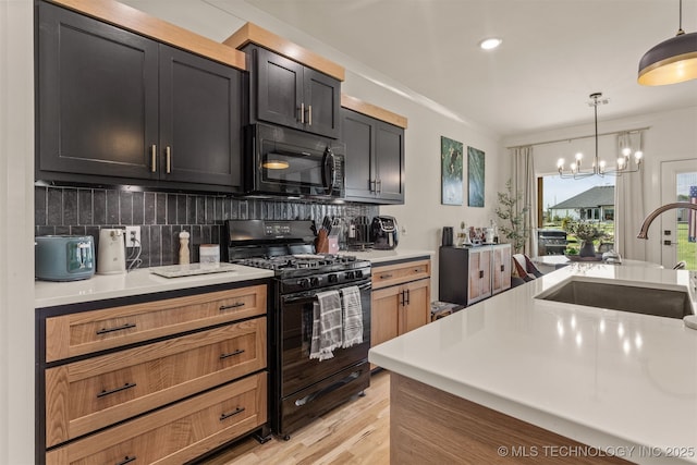 2407 W Union Pl, Collinsville, OK 74021 - kitchen with black appliances, light countertops, a chandelier, tasteful backsplash, and hanging light fixtures