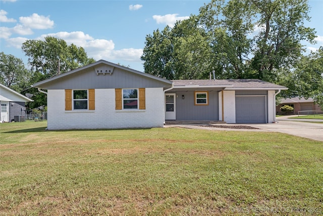 16524 E 2nd St, Tulsa, OK 74108 - ranch-style home with driveway, a garage, and brick siding