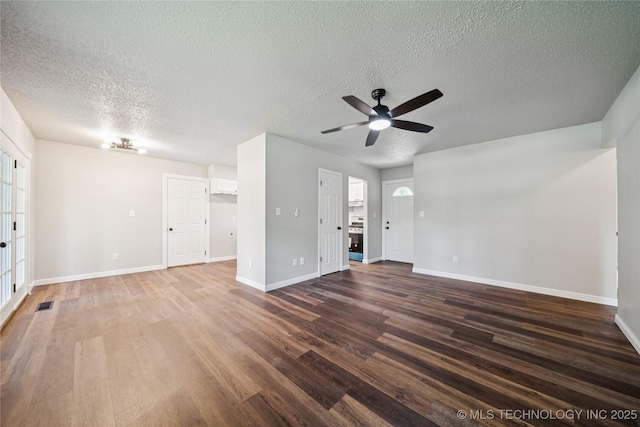 16524 E 2nd St, Tulsa, OK 74108 - unfurnished living room featuring wood finished floors, a ceiling fan, and a textured ceiling