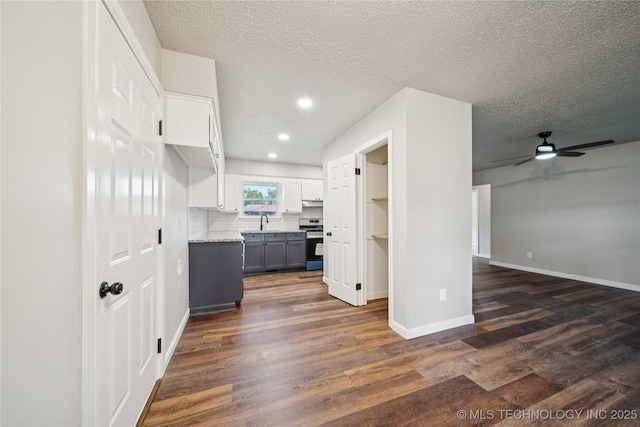 16524 E 2nd St, Tulsa, OK 74108 - kitchen featuring electric stove, open floor plan, dark wood finished floors, a ceiling fan, and recessed lighting