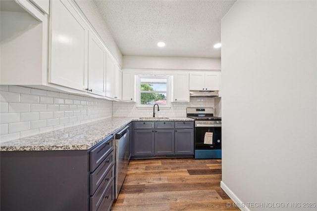 16524 E 2nd St, Tulsa, OK 74108 - kitchen featuring appliances with stainless steel finishes, under cabinet range hood, gray cabinets, a textured ceiling, and white cabinetry