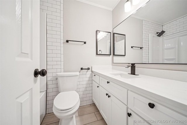 16524 E 2nd St, Tulsa, OK 74108 - bathroom with ornamental molding, vanity, tile walls, and shower / tub combination