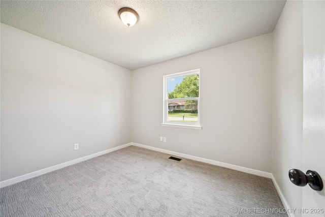 16524 E 2nd St, Tulsa, OK 74108 - unfurnished room featuring carpet floors and a textured ceiling