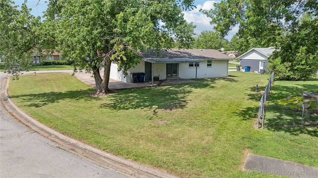 16524 E 2nd St, Tulsa, OK 74108 - view of yard featuring a garage and driveway