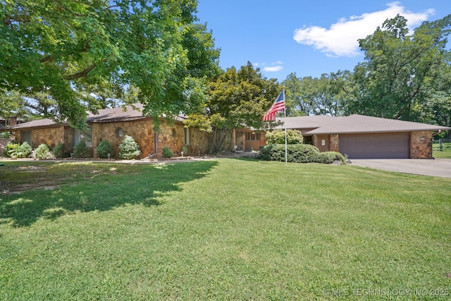2425 E 53rd St, Tulsa, OK 74105 - view of grassy yard with a garage and driveway