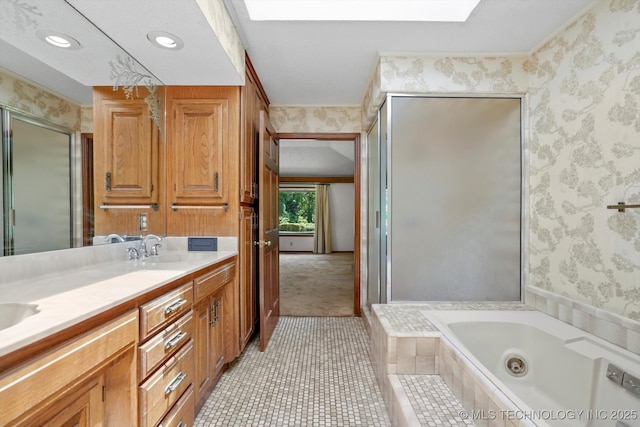2425 E 53rd St, Tulsa, OK 74105 - full bath featuring wallpapered walls, a bath, a skylight, double vanity, and a shower stall
