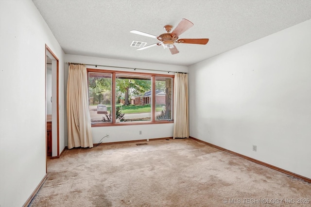 2425 E 53rd St, Tulsa, OK 74105 - carpeted empty room featuring a textured ceiling and ceiling fan