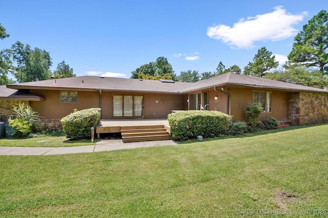 2425 E 53rd St, Tulsa, OK 74105 - back of house with stone siding, a yard, and a wooden deck