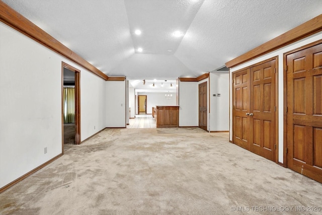 2425 E 53rd St, Tulsa, OK 74105 - unfurnished living room with lofted ceiling, light carpet, and ornamental molding