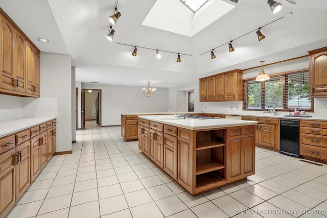 2425 E 53rd St, Tulsa, OK 74105 - kitchen with rail lighting, a skylight, light countertops, and brown cabinetry