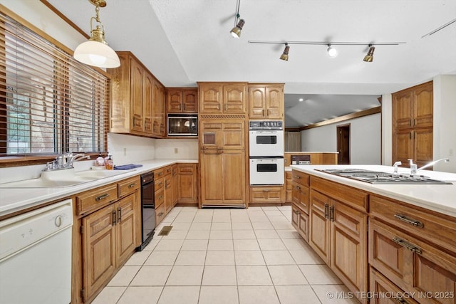 2425 E 53rd St, Tulsa, OK 74105 - kitchen featuring white appliances, light tile patterned floors, light countertops, brown cabinetry, and lofted ceiling