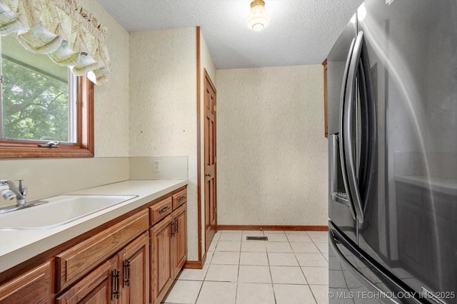 2425 E 53rd St, Tulsa, OK 74105 - bathroom featuring a textured ceiling, vanity, and tile patterned floors