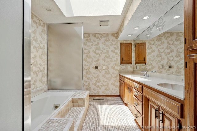2425 E 53rd St, Tulsa, OK 74105 - bathroom featuring wallpapered walls, double vanity, a garden tub, recessed lighting, and tile patterned flooring