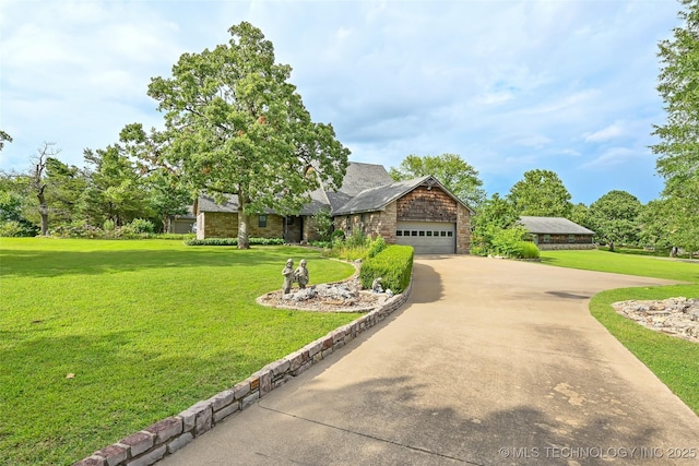 32069 Meadow Ln, Mannford, OK 74044 - view of front of home featuring a front yard, driveway, stone siding, and a garage